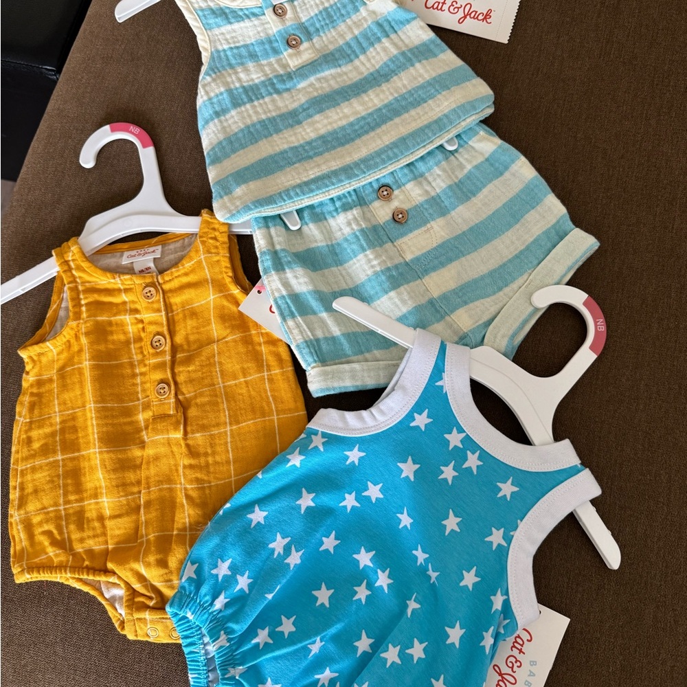 Baby newborn and 3 month old onesies, mittens, socks and outfits. Over 24 piece